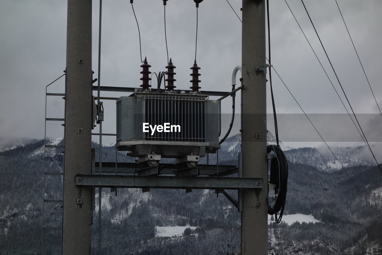 sky, nature, vehicle, transport, no people, transportation, cable, architecture, electricity, mast, day, outdoors, cloud, mountain, iron, technology, snow, built structure, tower, cable car, metal