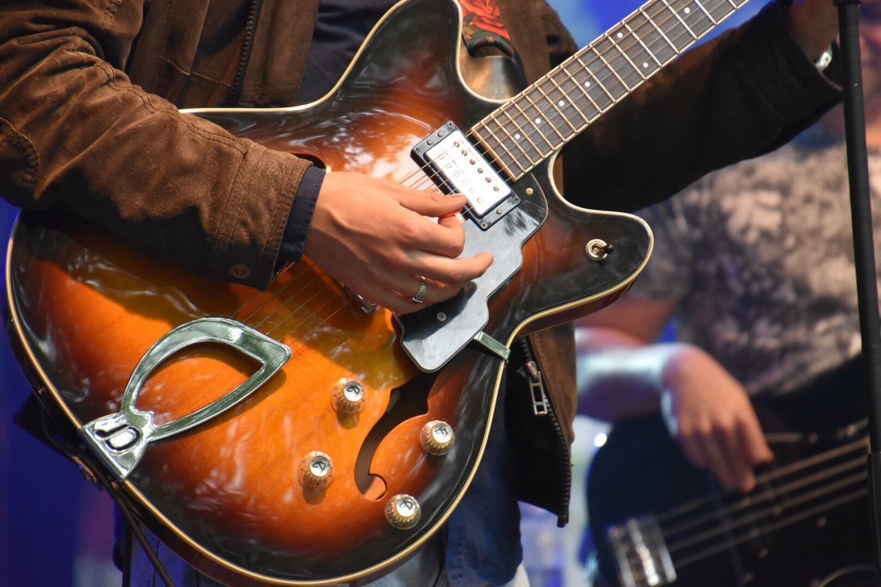 Close-up of guitarist playing guitar