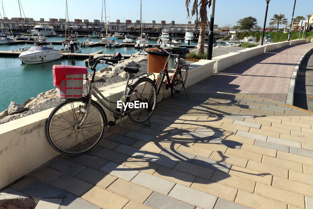 BICYCLE PARKED ON FOOTPATH BY STREET