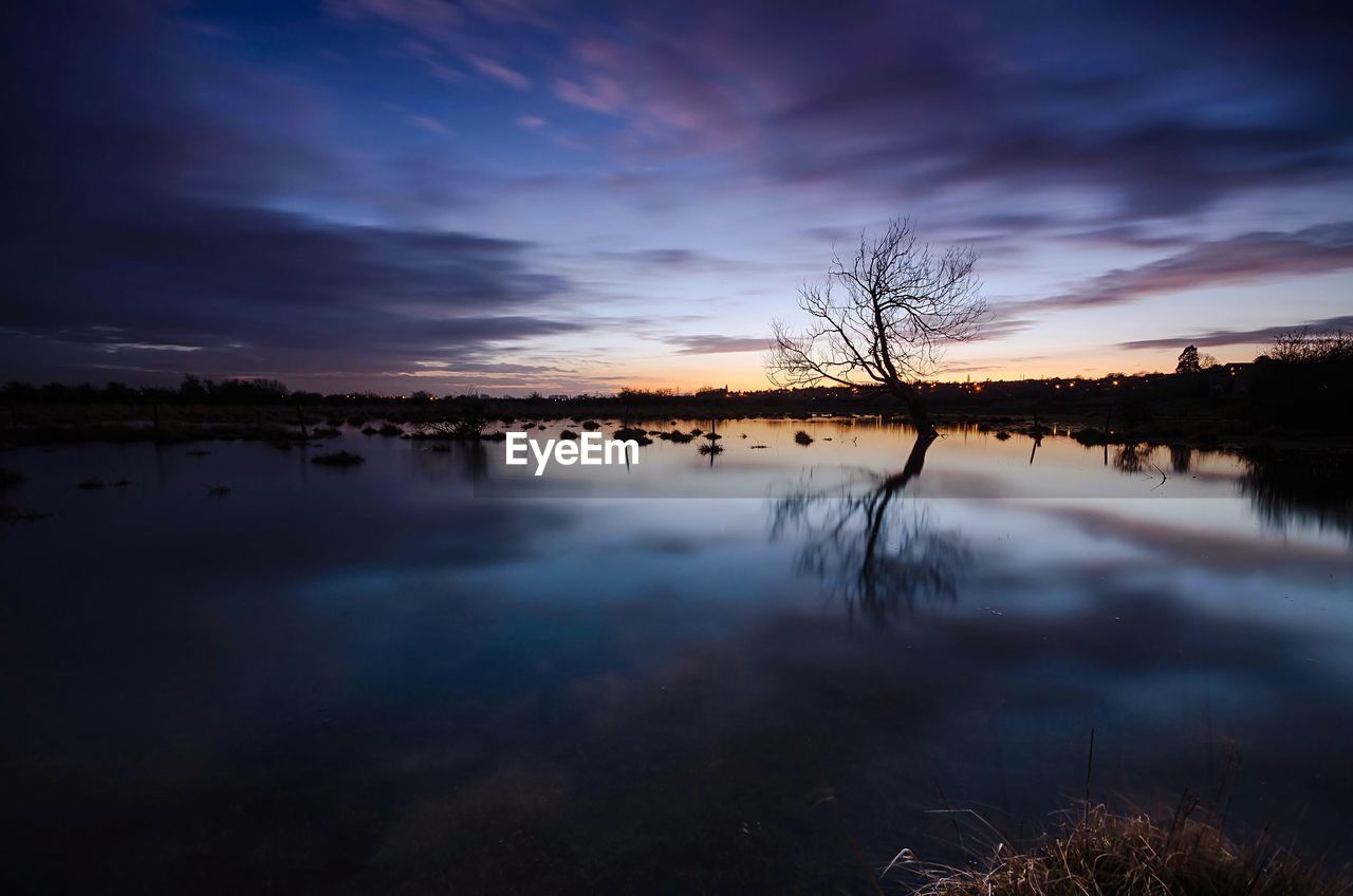 Scenic view of lake during sunset