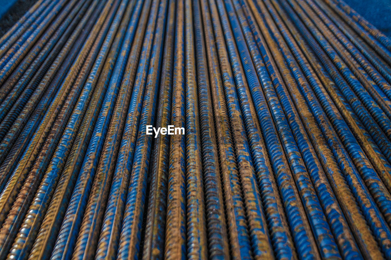 Full frame shot of blue rusty iron rods