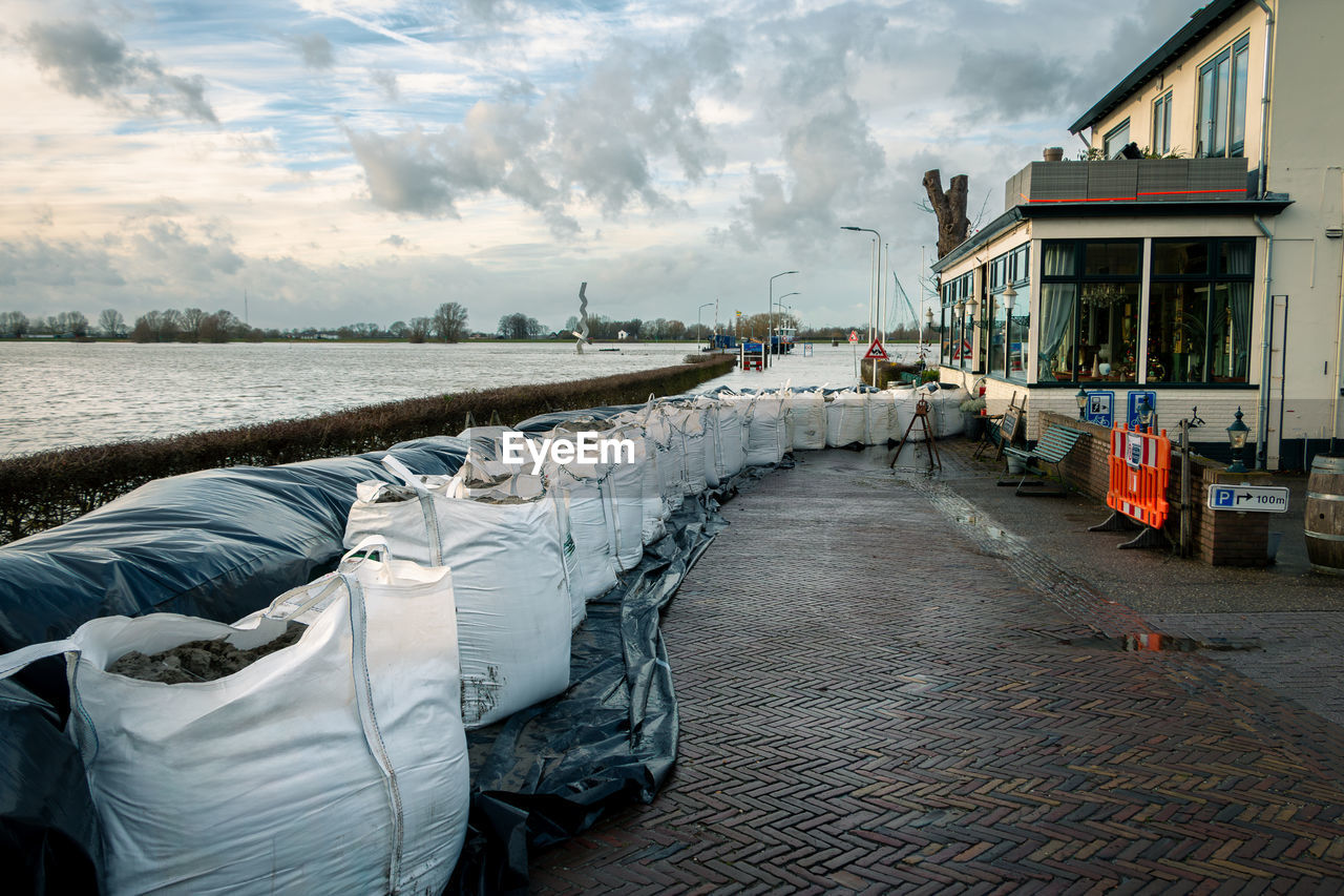 cloud, sky, water, architecture, nature, transportation, built structure, building exterior, sea, travel destinations, morning, travel, city, mode of transportation, beach, building, outdoors, street, nautical vessel, no people, environment, tourism, day, land, holiday, landscape