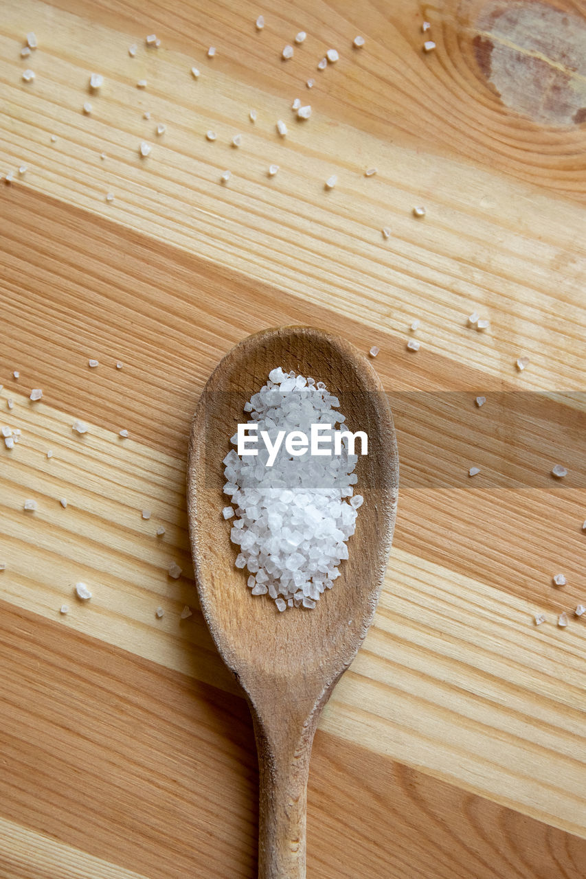 Sea salt on wooden spoon