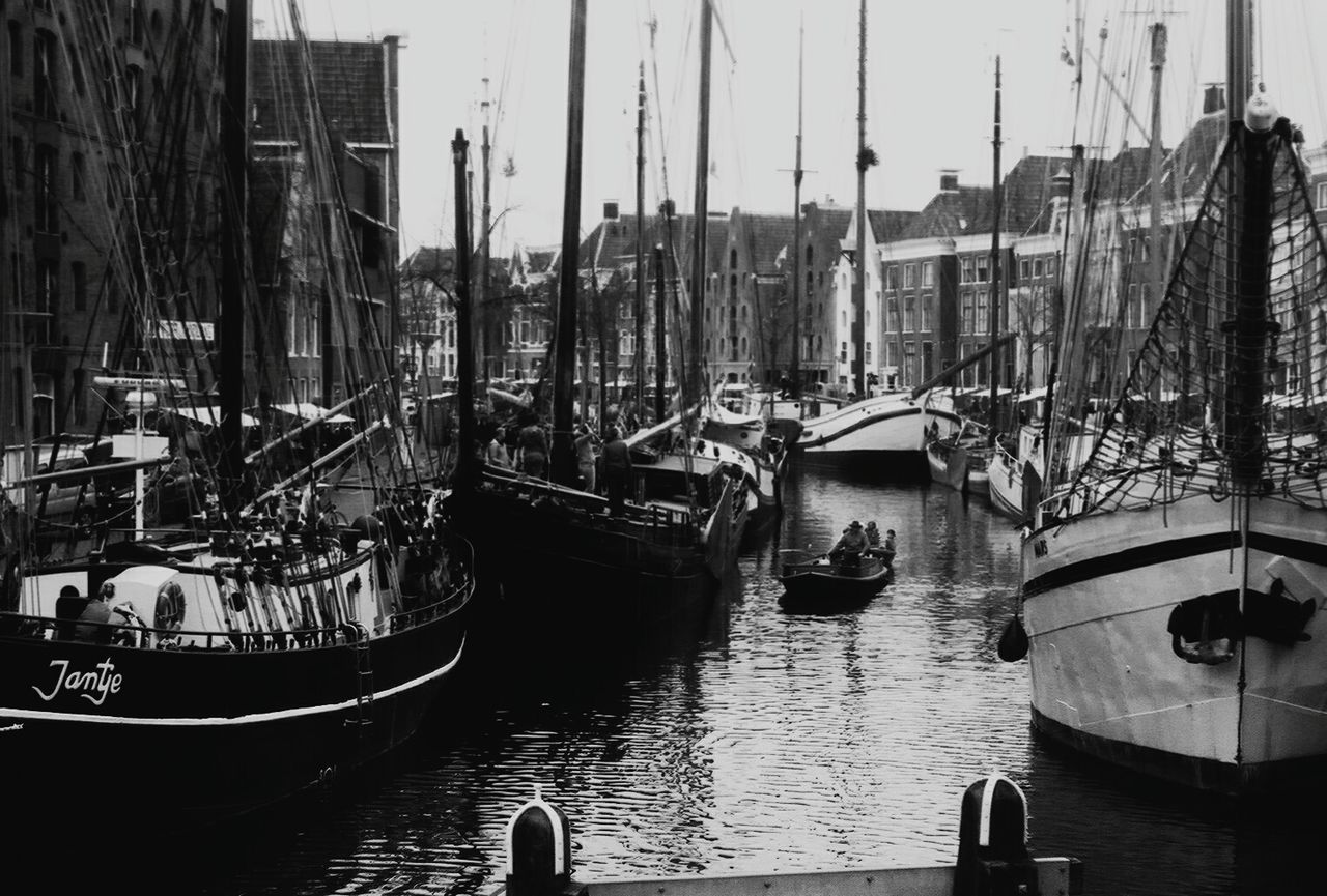 BOATS MOORED IN RIVER