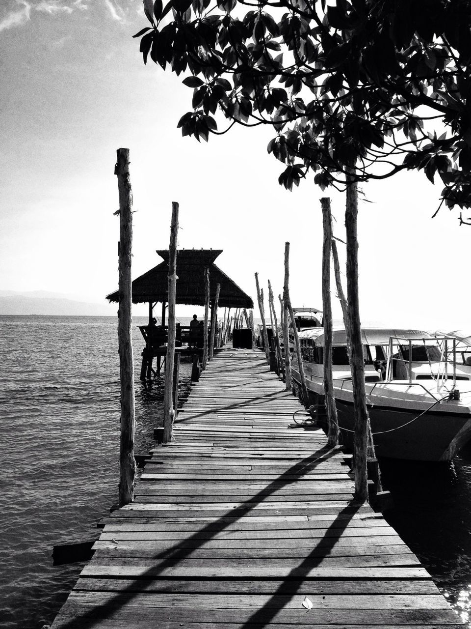 Long wooden jetty at calm sea