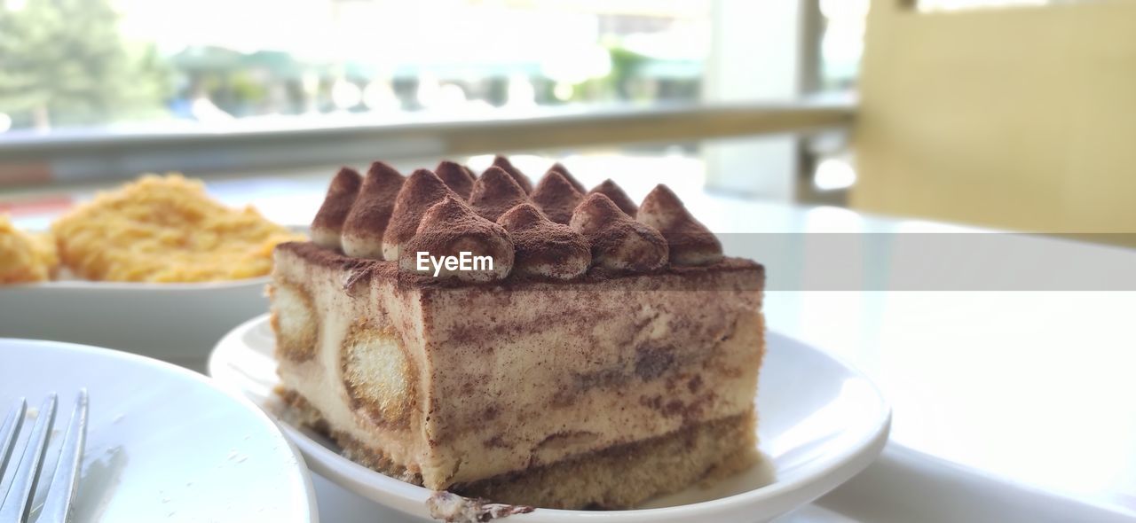 Close-up of cake in plate on table