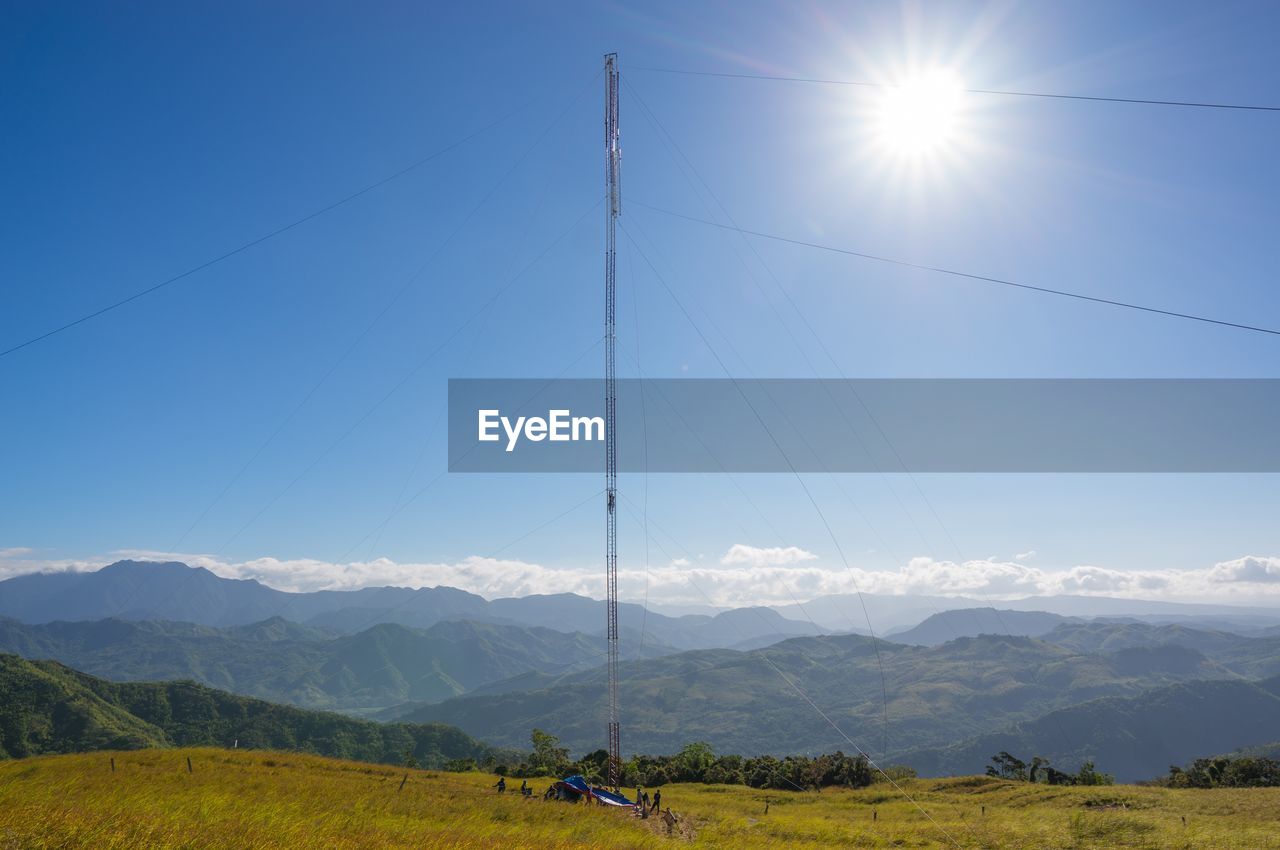 Communications tower being built on top of a mountain.