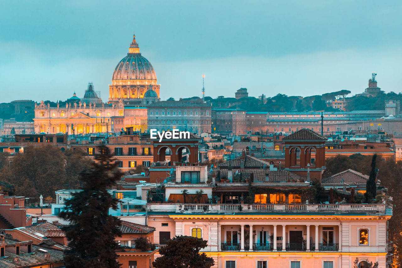 Buildings in city against sky of rome 