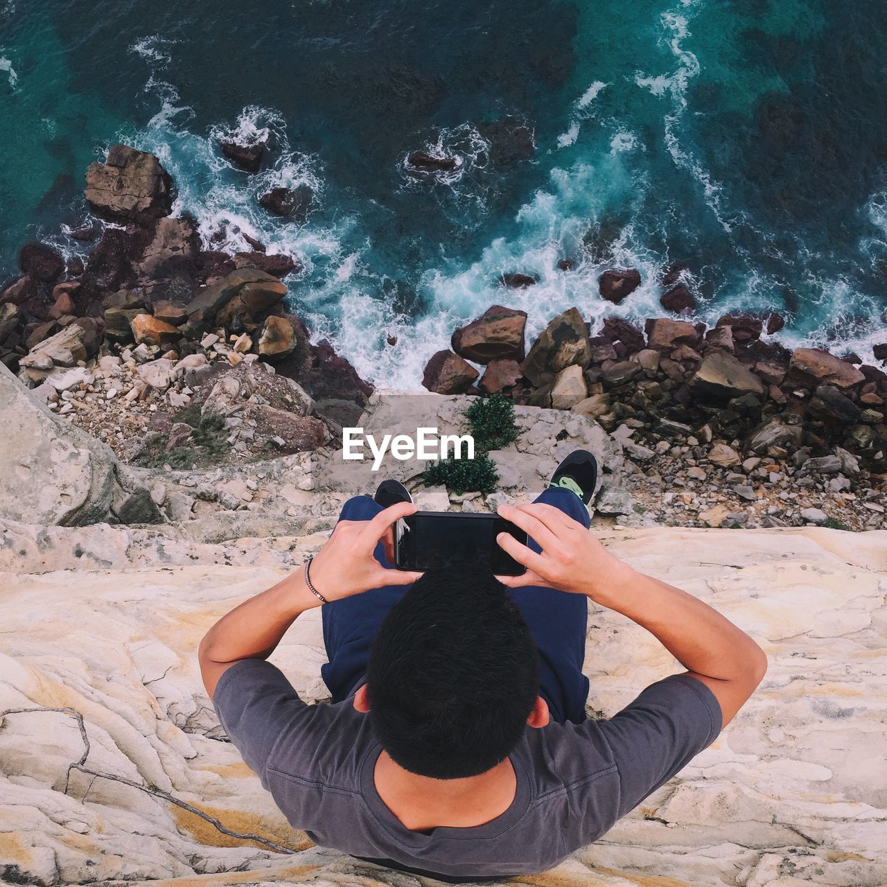 High angle view of man photographing sea