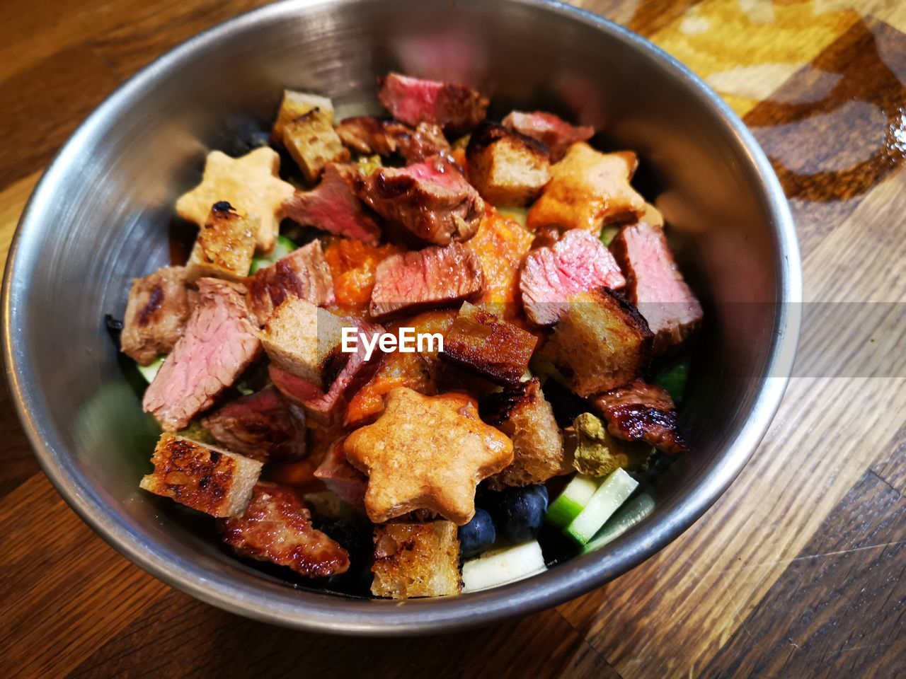 High angle view of dog food in bowl on table