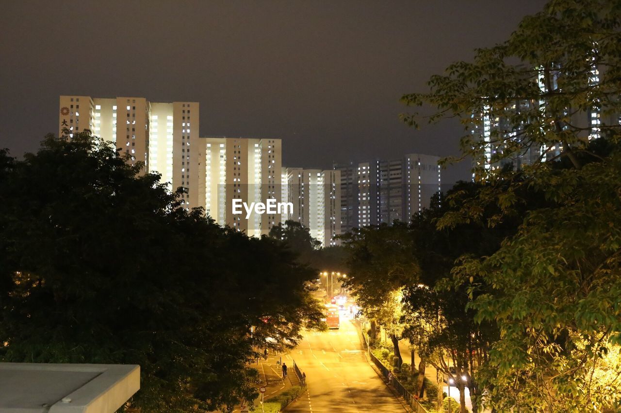 View of skyscrapers lit up at night