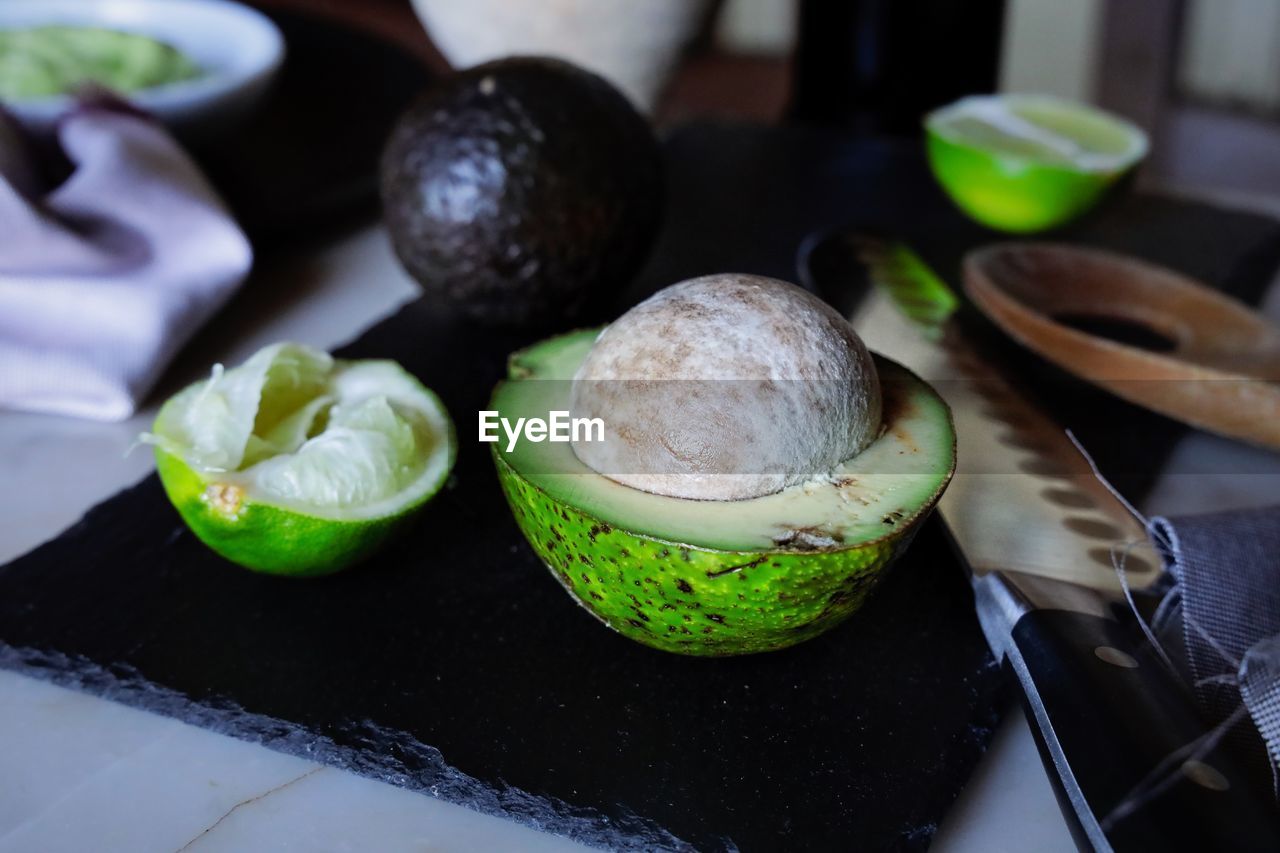 High angle view of  avocadofruits in plate on table