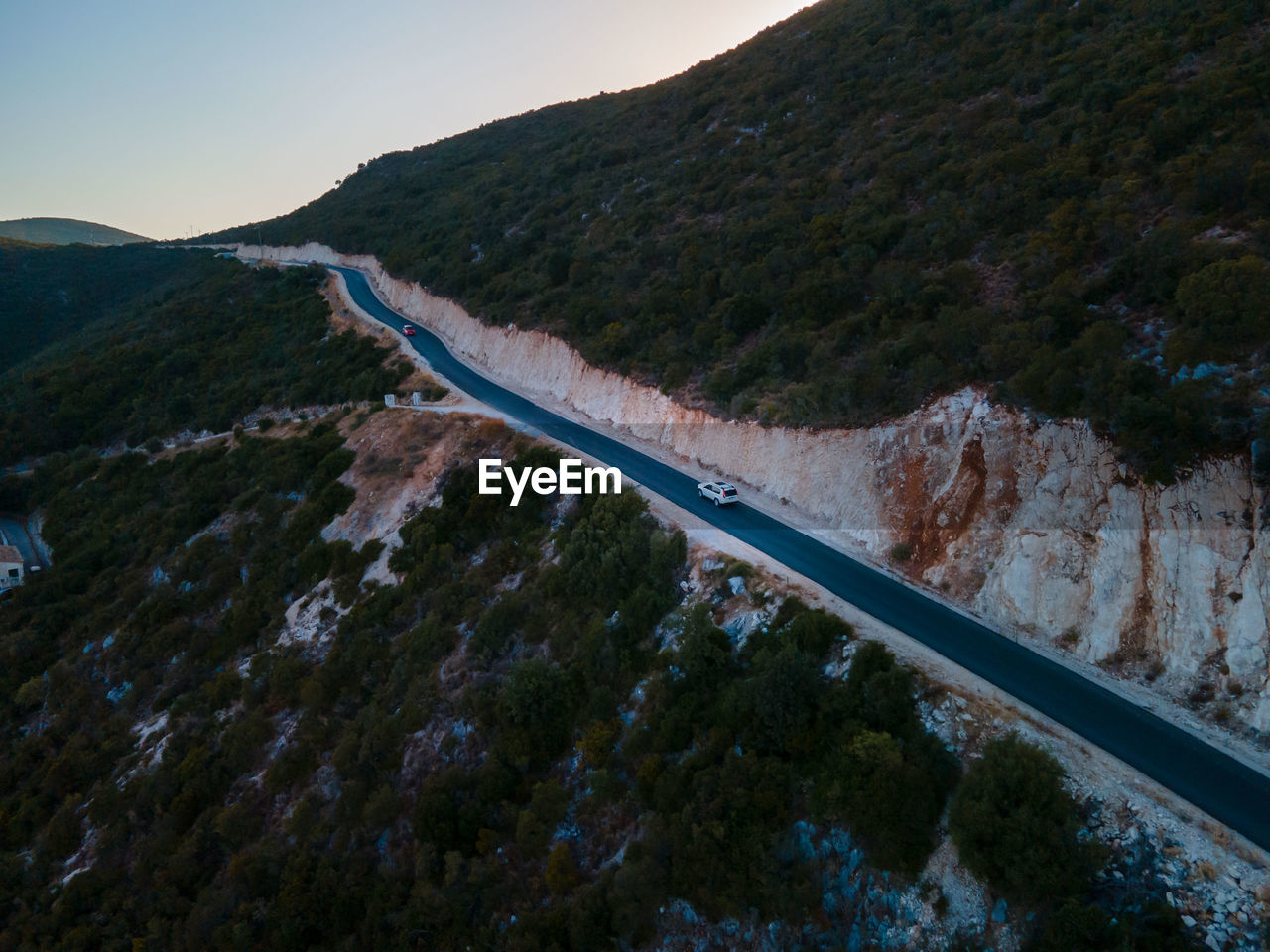 high angle view of road by mountain against sky