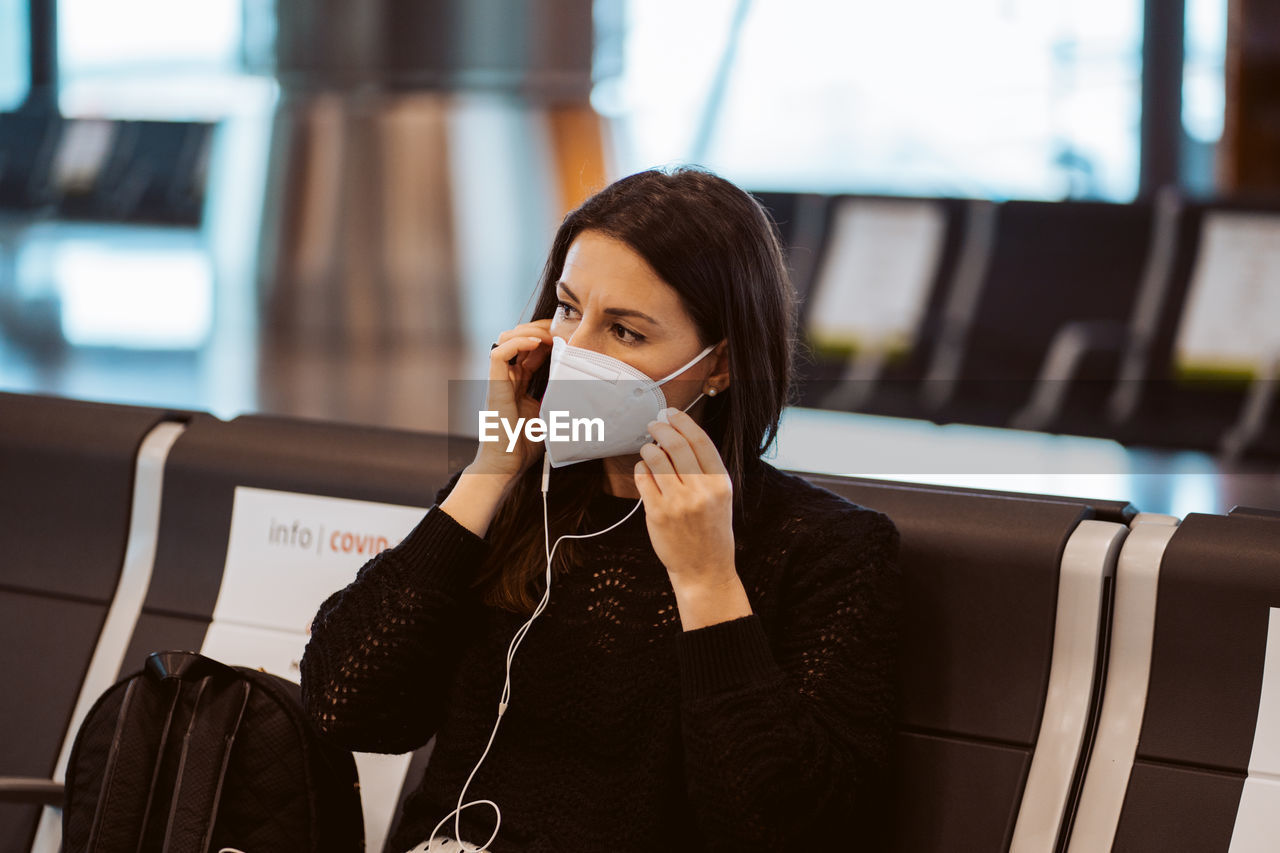 portrait of young woman using mobile phone