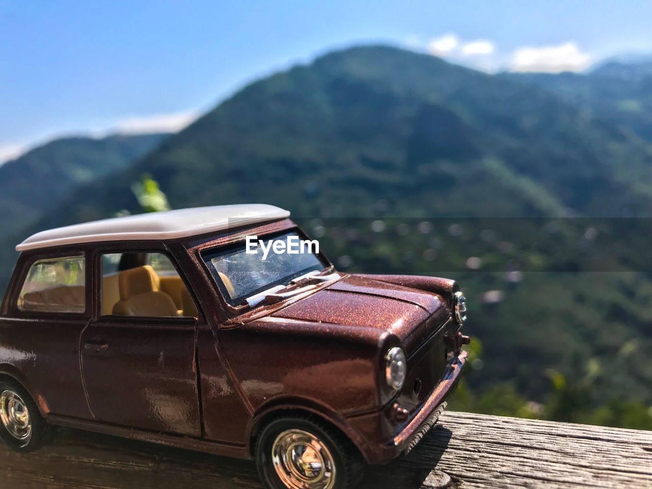 Vintage car against mountain range