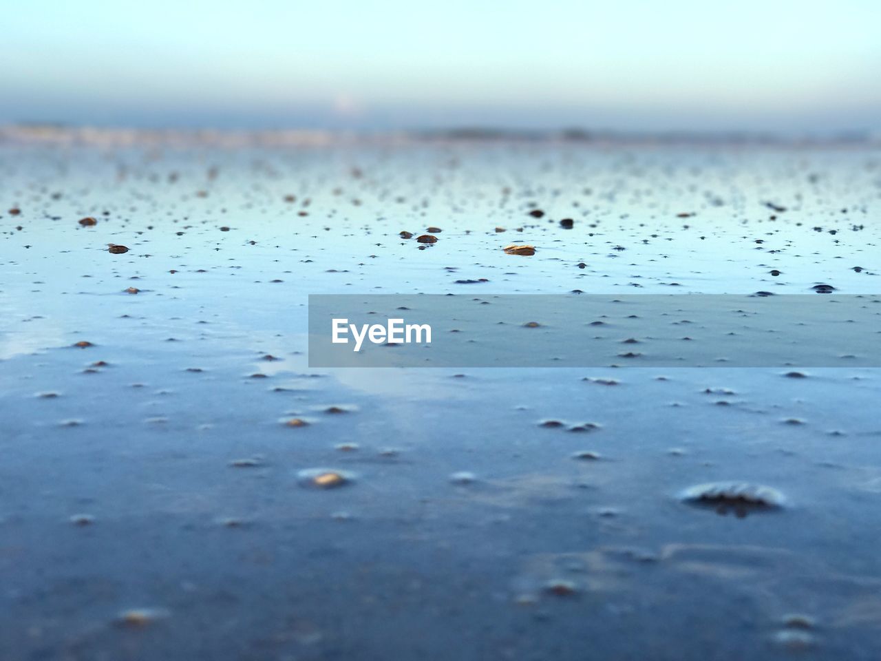 FULL FRAME SHOT OF WET GLASS WITH RAIN DROPS