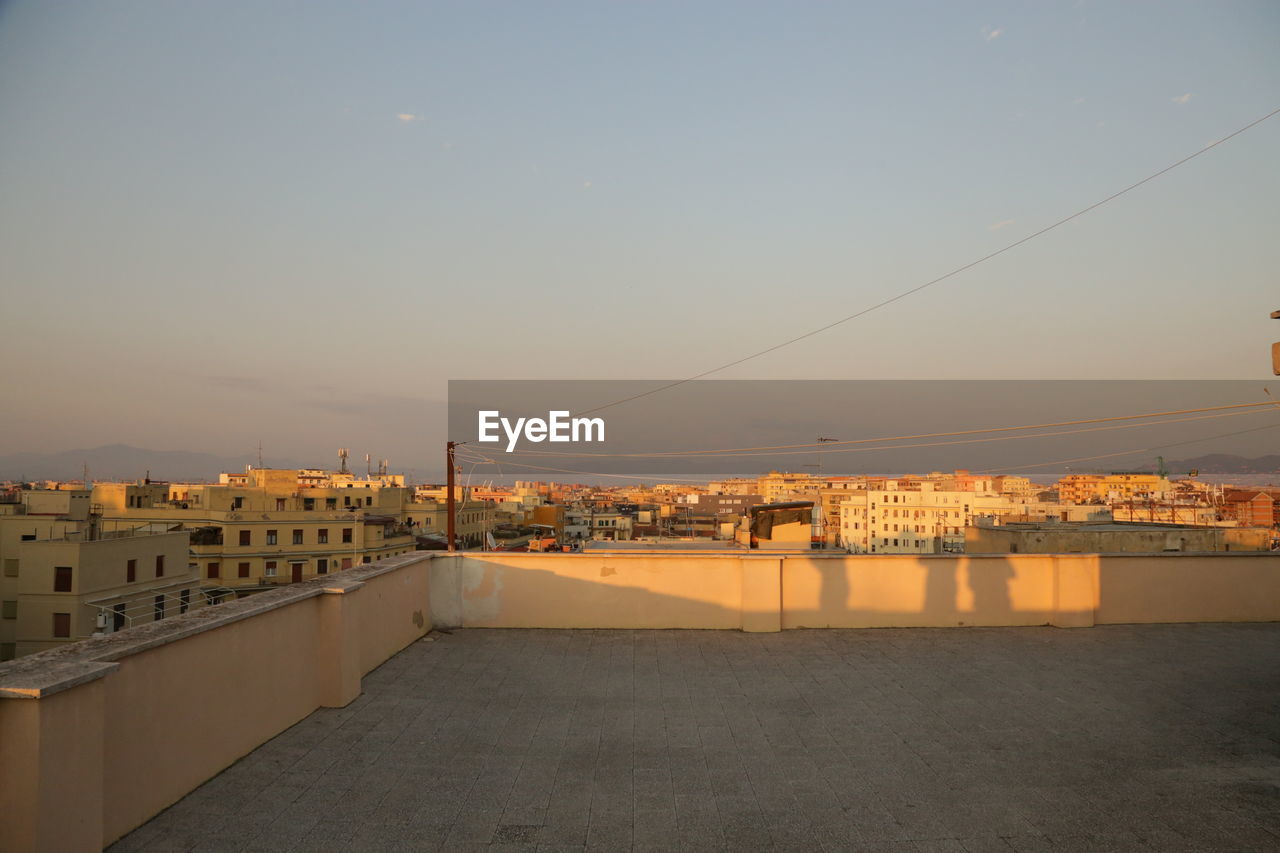 RESIDENTIAL BUILDINGS AGAINST SKY DURING SUNSET