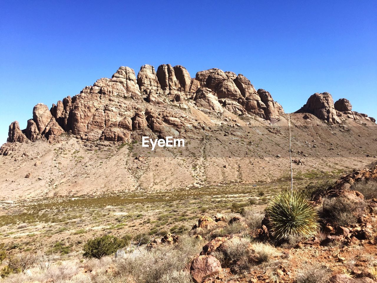 Scenic view of rocky mountains against clear sky