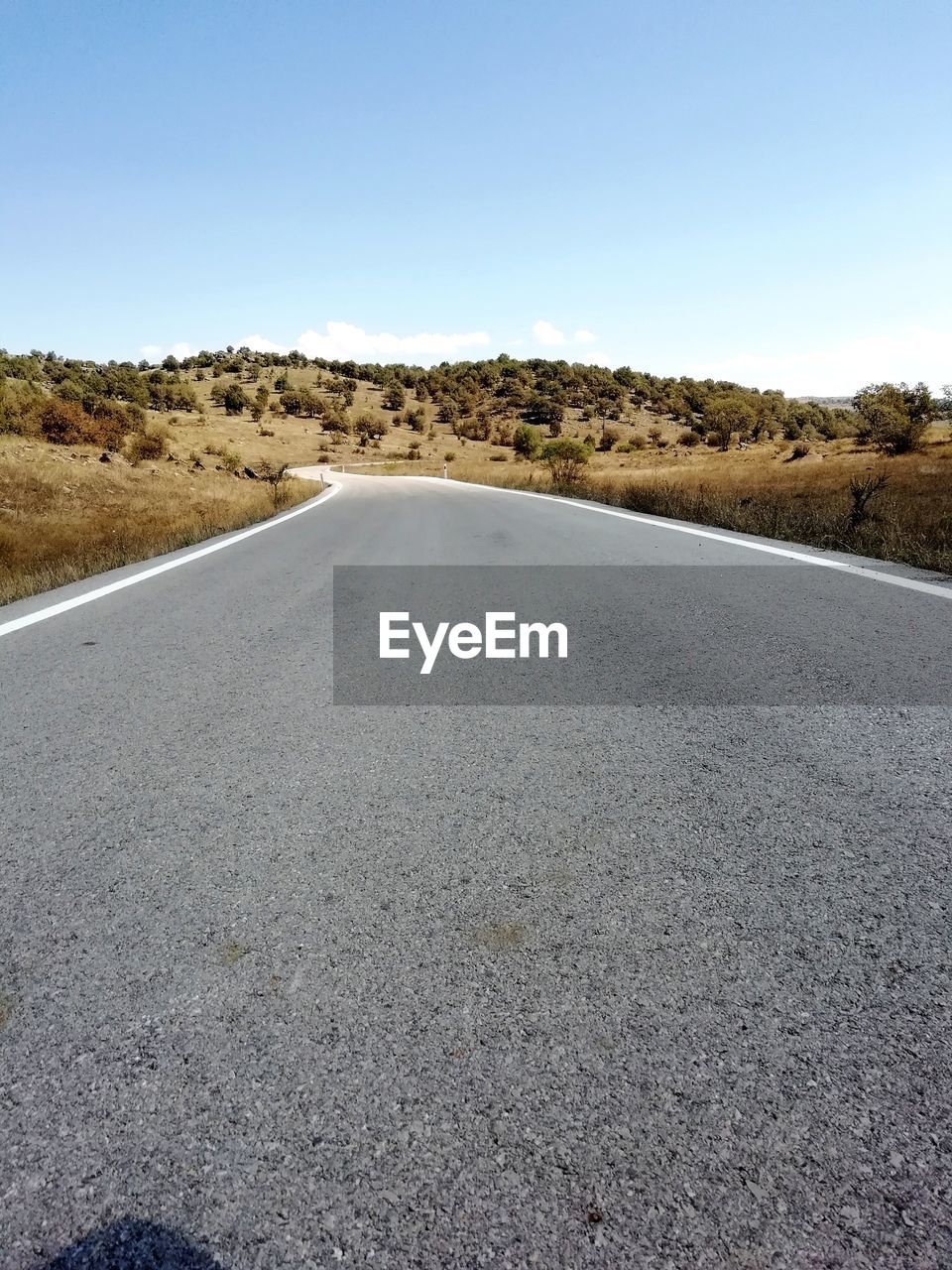 SURFACE LEVEL OF ROAD AMIDST LAND AGAINST SKY