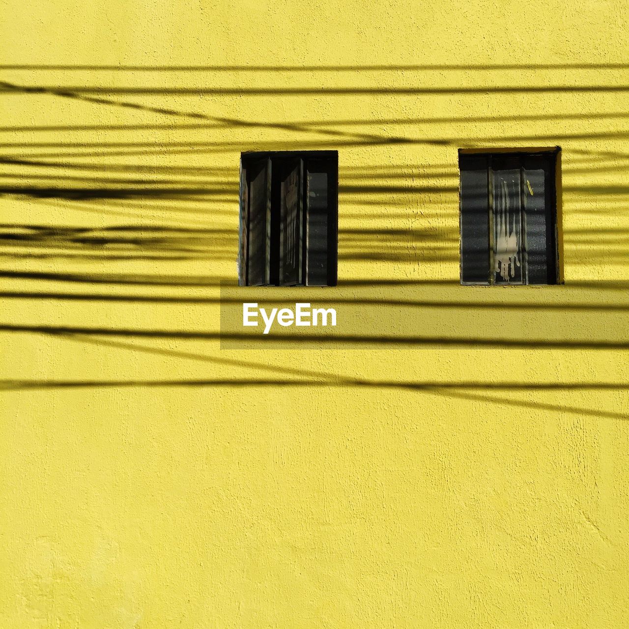 Electric cables shadow on wall