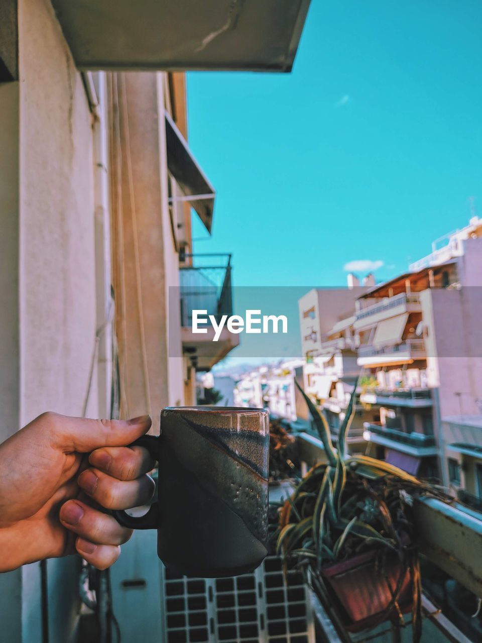 Morning coffee at balcony in pagrati, athens