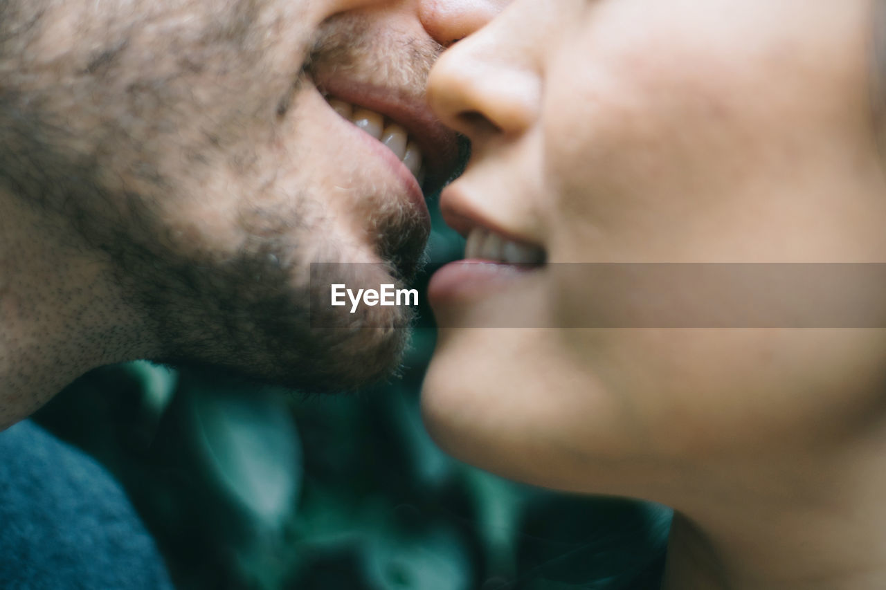 Cropped image of man and woman embracing