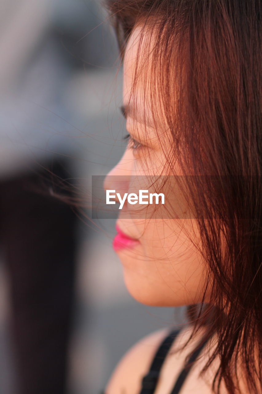 Close-up of woman looking away