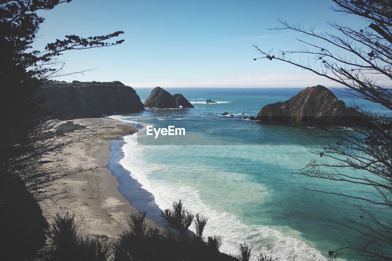 Scenic view of sea against blue sky