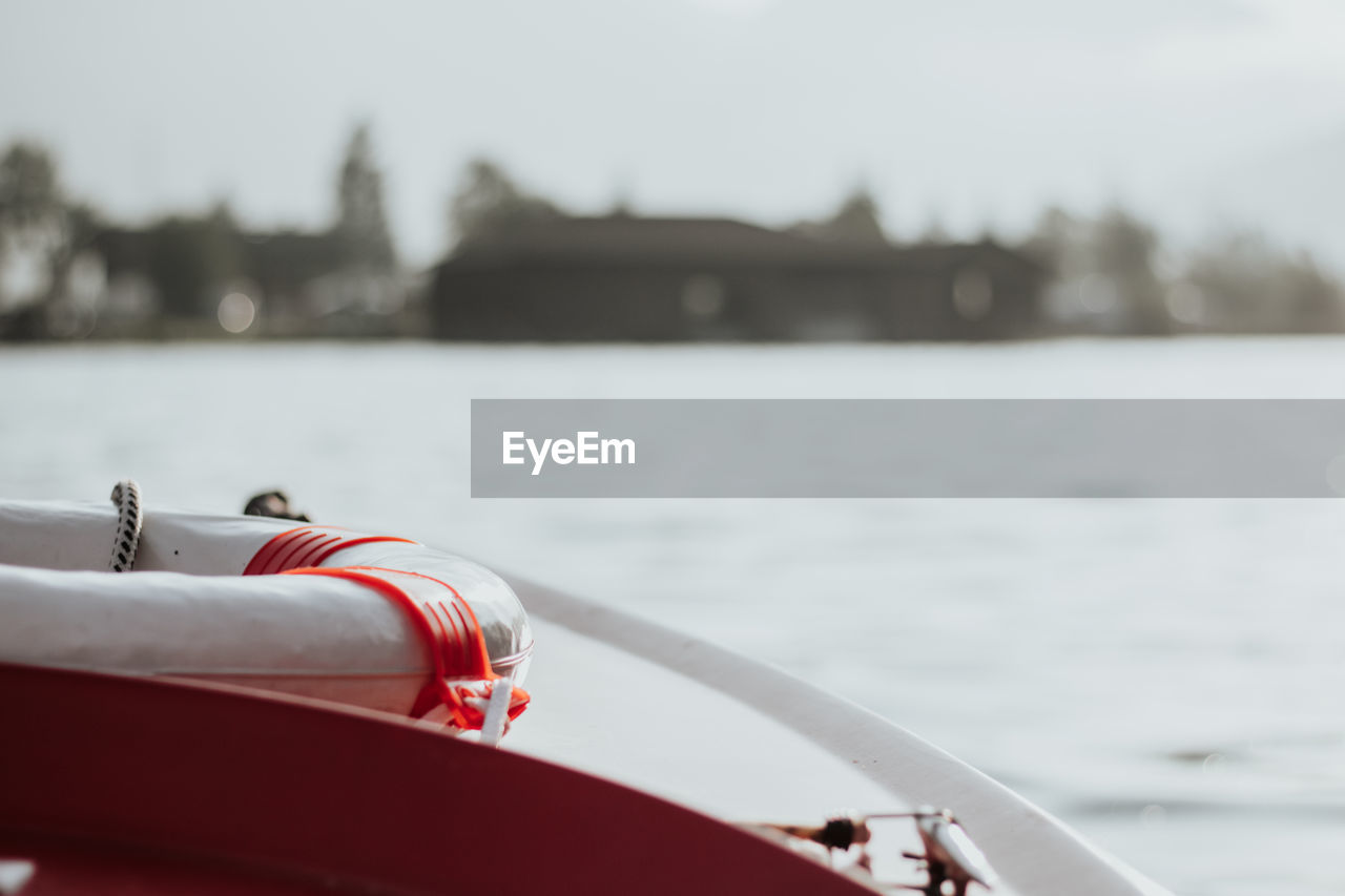 Close-up of red boat on lake