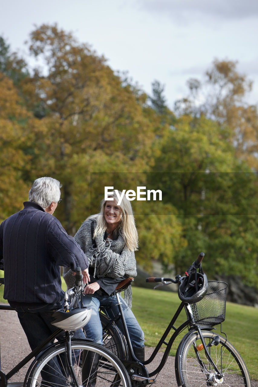 Senior couple cycling, delsjon, gothenburg, sweden