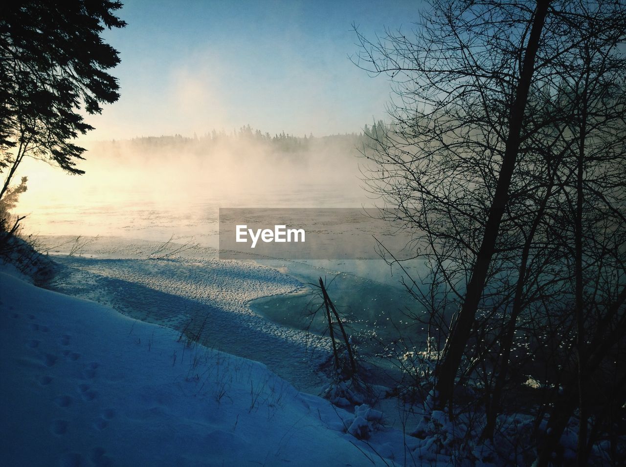 Frozen lake against sky