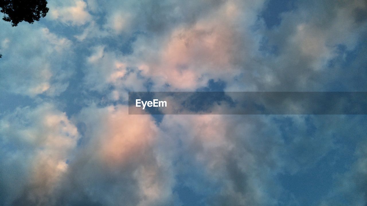 LOW ANGLE VIEW OF CLOUDS IN BLUE SKY