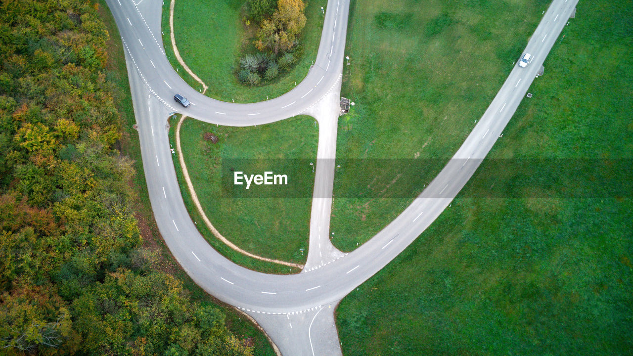 aerial view, green, plant, high angle view, grass, no people, nature, road, day, transportation, land, outdoors, environment, field, growth, landscape, tree, mode of transportation, sports