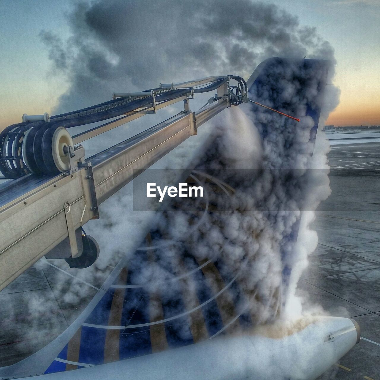 De-icing airplane at airport