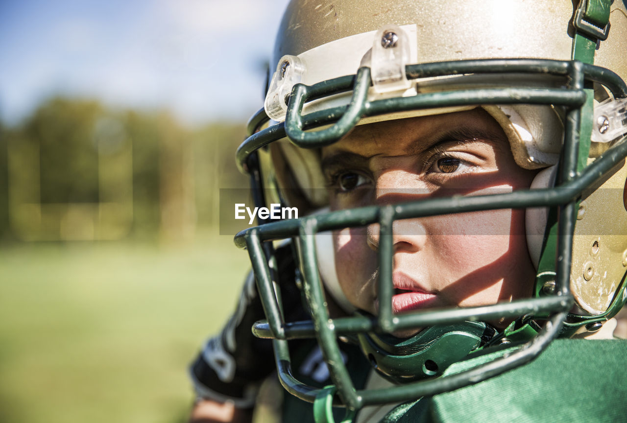 Close-up of american football player looking away