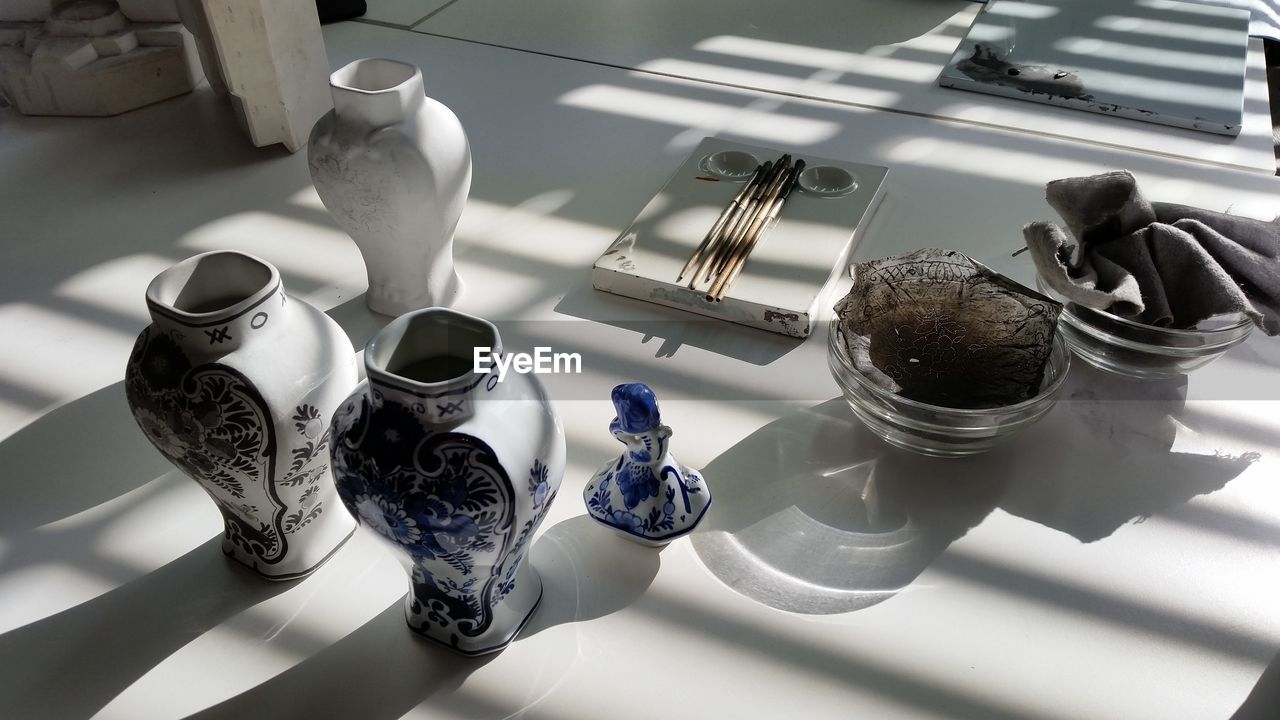 High angle view of vases on table