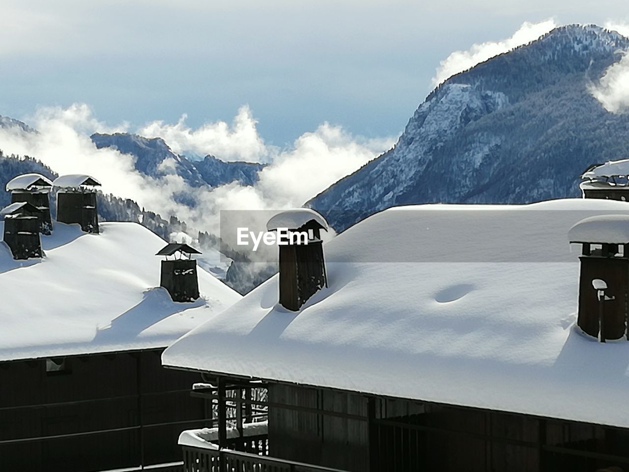 VIEW OF CAMERA AGAINST CLOUDY SKY