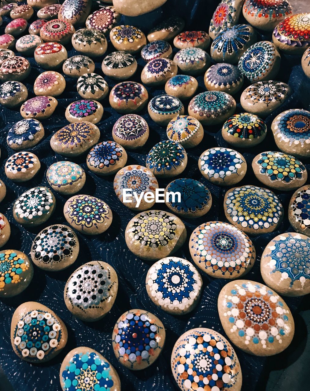 High angle view of multi colored stones for sale at market stall