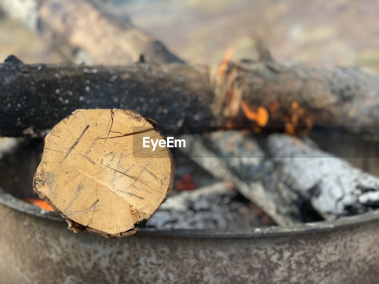 Close-up of firewood on wood