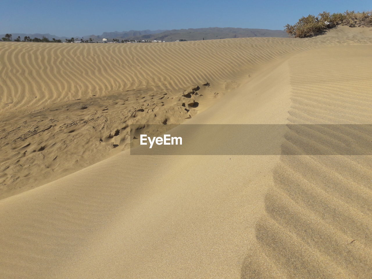 Sand dunes in maspalomas against sky