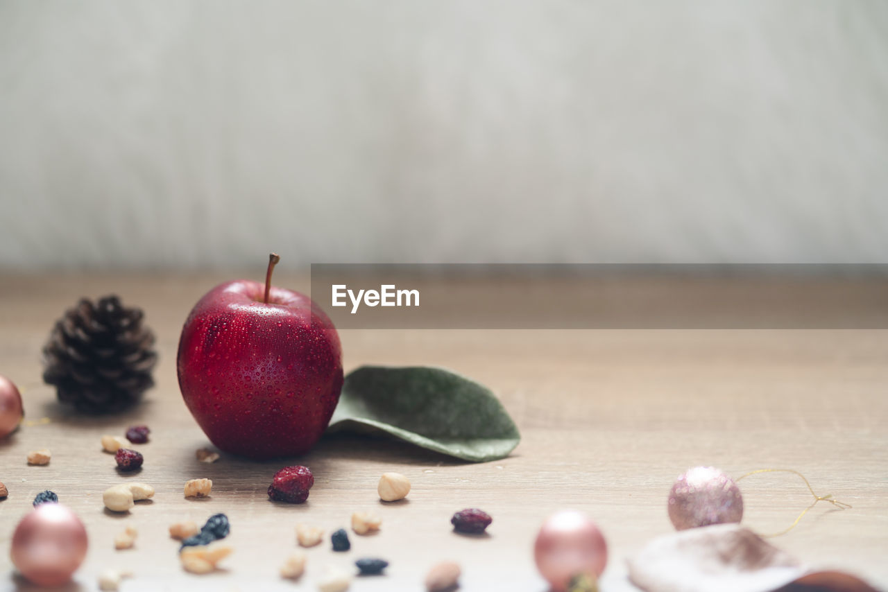 Close-up of apple on table at home