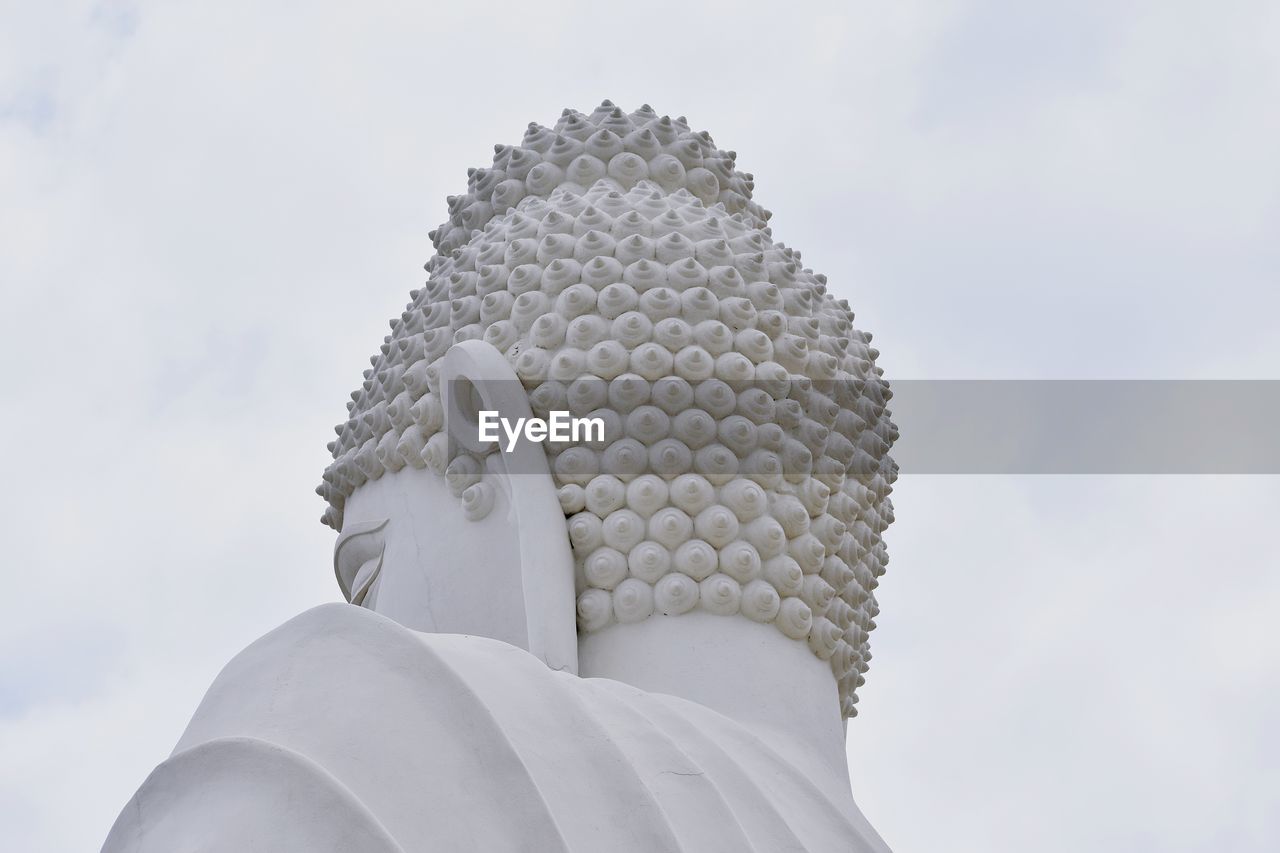 Low angle view of statue against sky