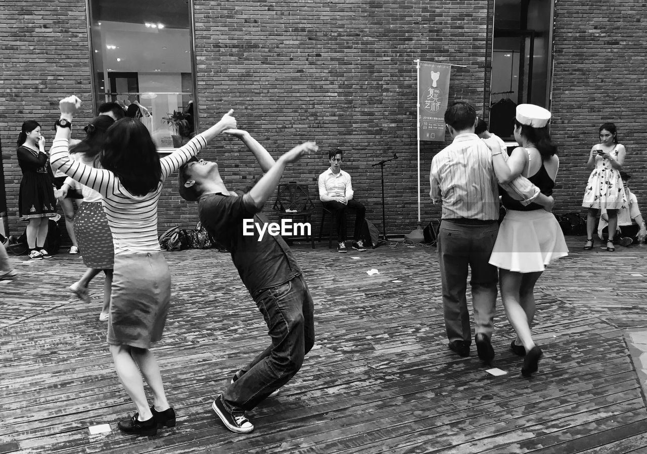 PEOPLE STANDING ON STREET