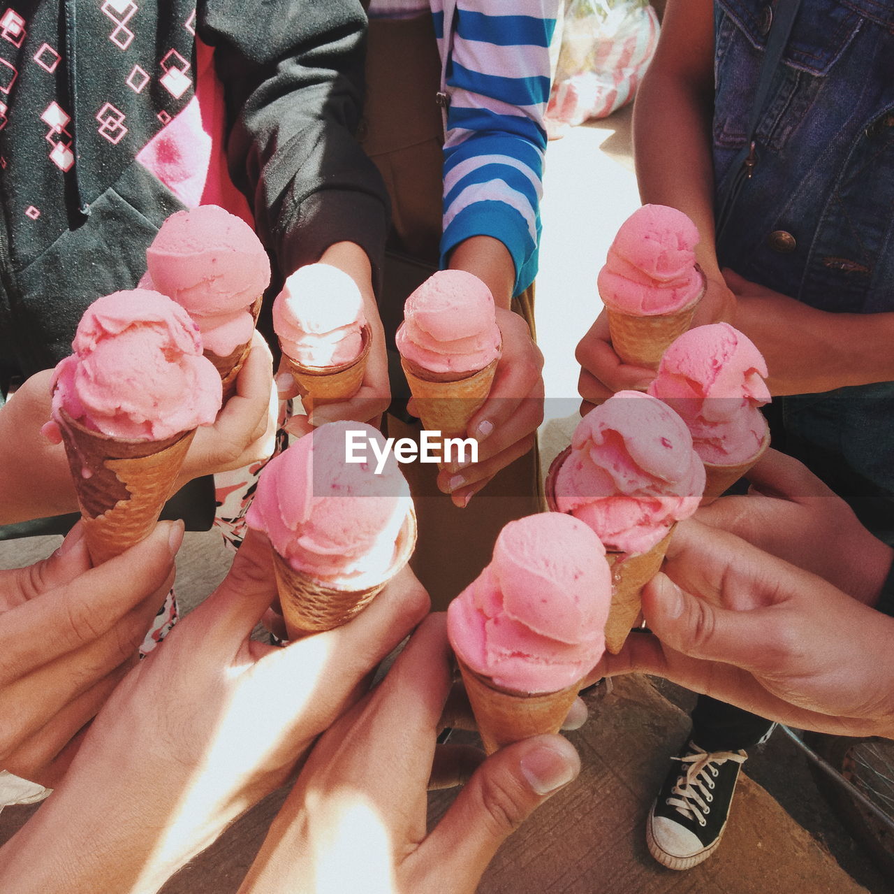 High angle view of people holding ice cream cones