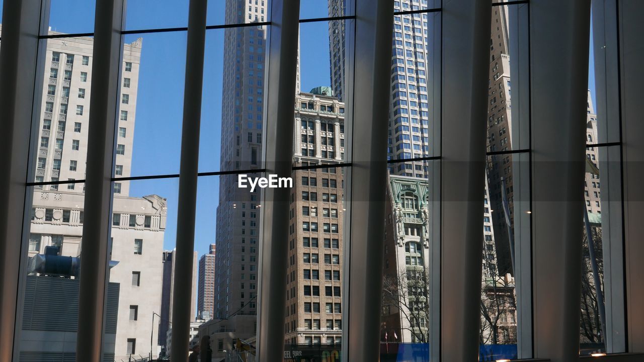 LOW ANGLE VIEW OF MODERN BUILDINGS AGAINST SKY