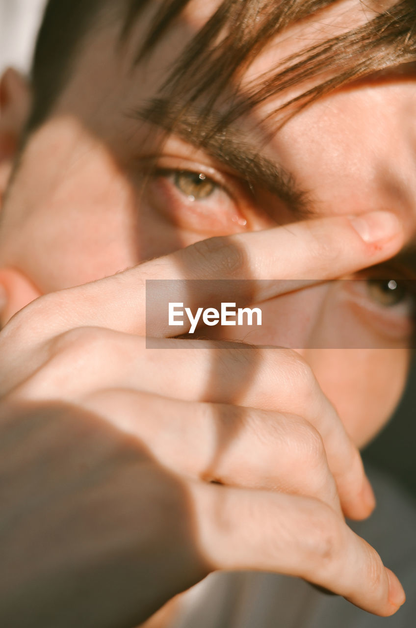 Close-up portrait of young men at golden hour