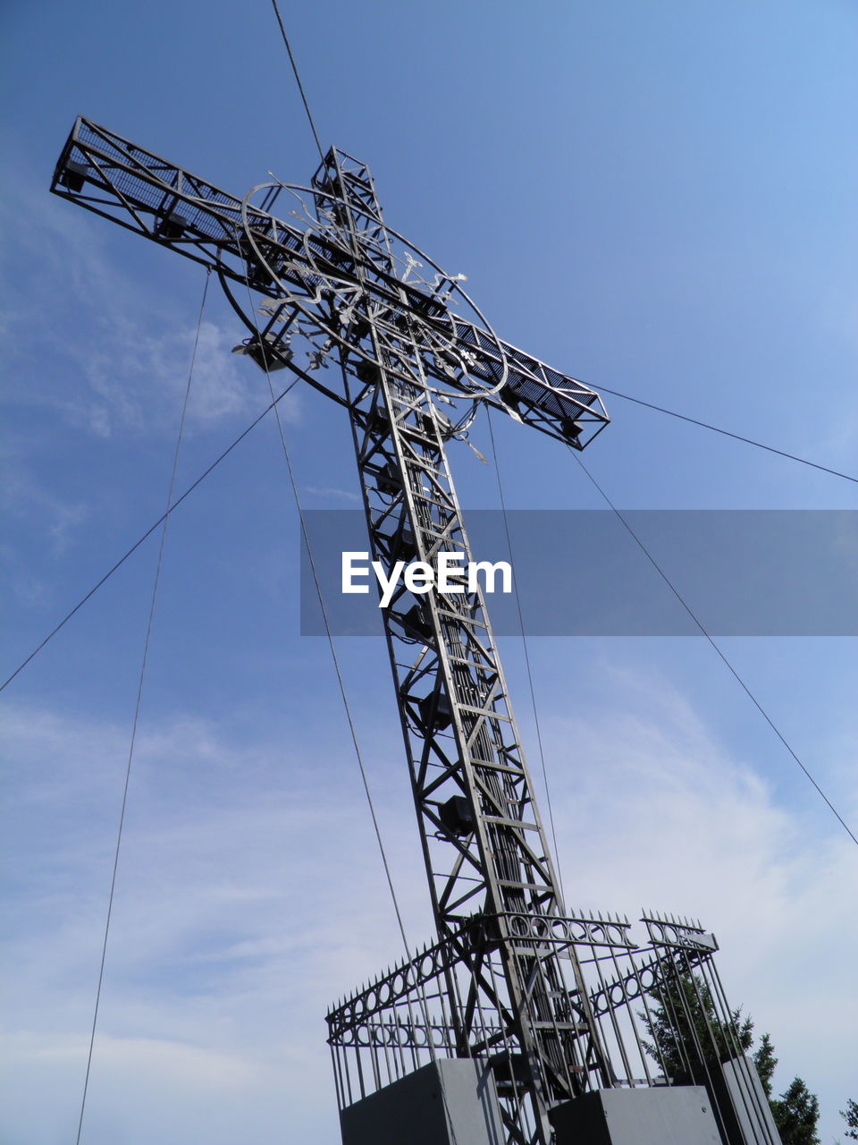 LOW ANGLE VIEW OF CRANES AGAINST BLUE SKY