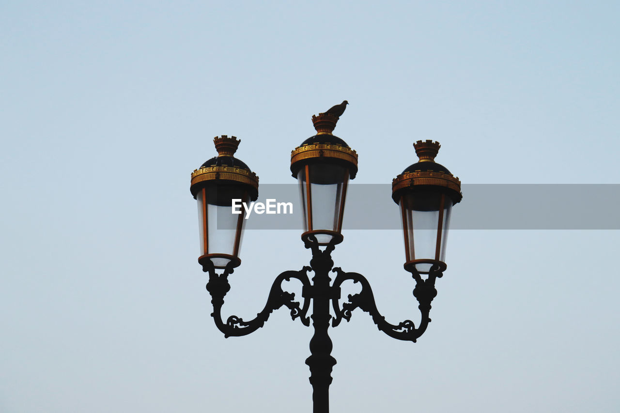 light fixture, street light, lighting equipment, lighting, clear sky, sky, street, no people, low angle view, nature, copy space, lamp, outdoors, day, metal, retro styled, electric lamp