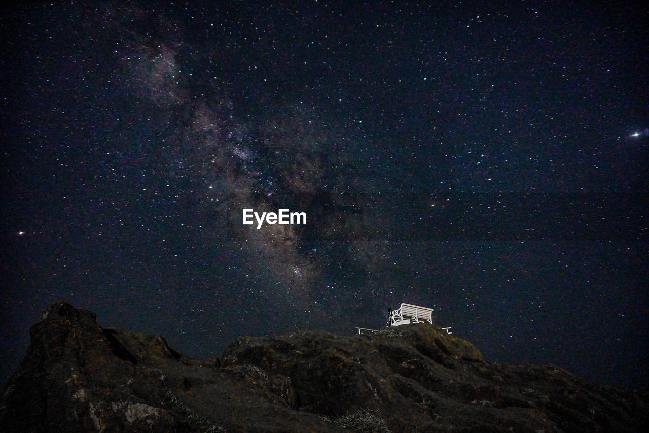 LOW ANGLE VIEW OF STARS AGAINST SKY AT NIGHT