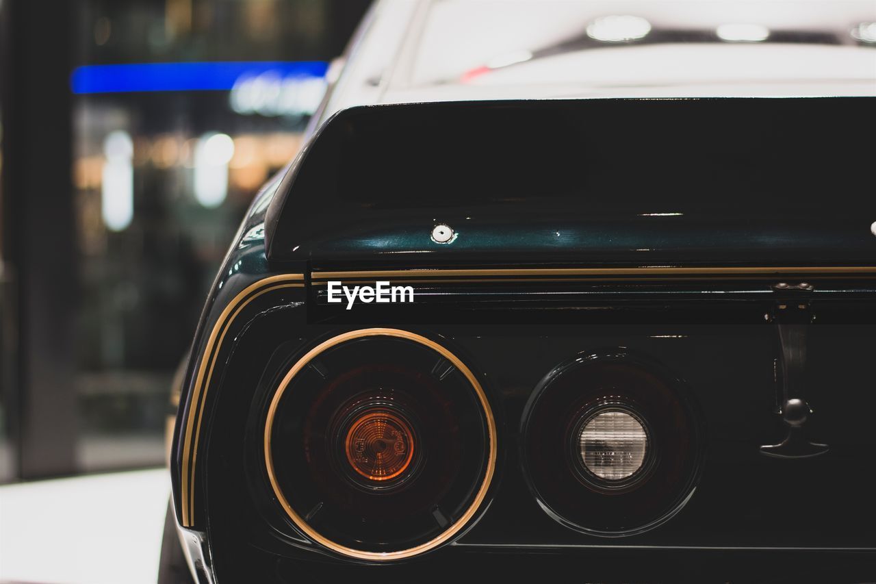 Close-up of car on road